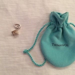 Tiffany & Co. Atlas cube charm with a diamond.