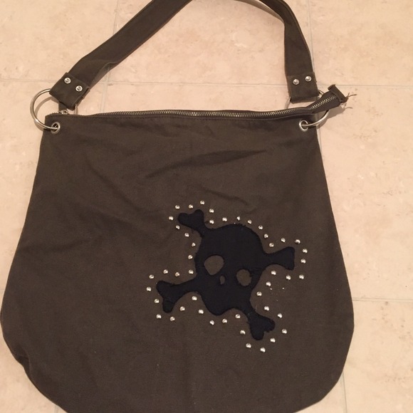 Skull and cross bone details cloth hand bag