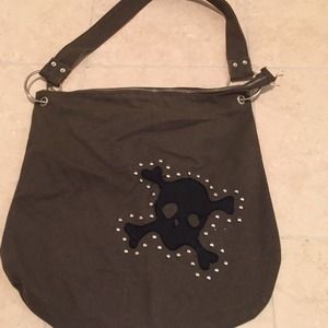 Skull and cross bone details cloth hand bag
