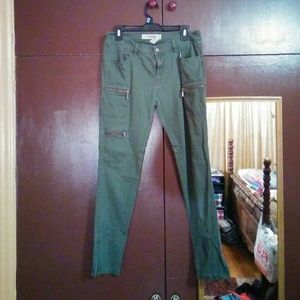 Green skinny pants.