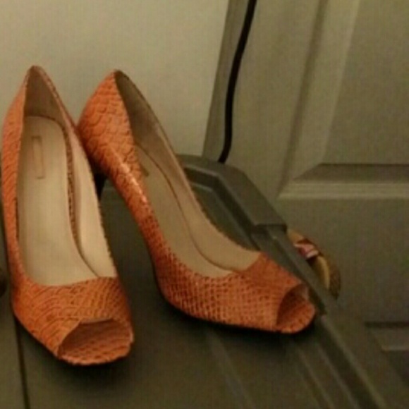 Orange peep toe snakeskin pumps. 4 inches