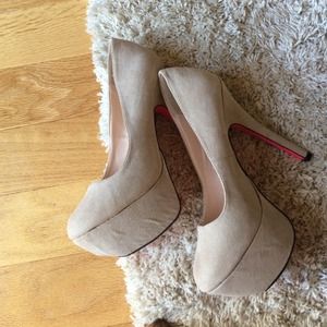 Nude heels.  Worn once.
