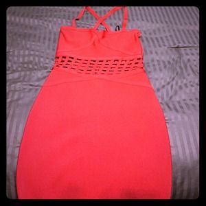 bebe red bodycon dress with cutout pattern.
