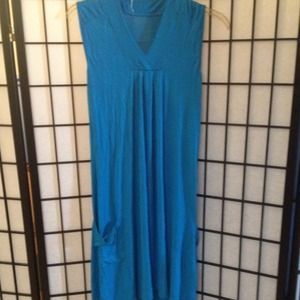Worn teal blue dress with side pockets
