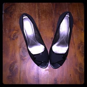 Black peep toe pumps with button detail