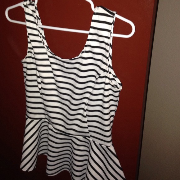 Black and white stripe shirt. Flows on the bottom