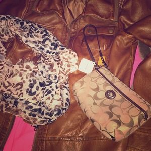 NWT. Authentic Coach medium size wristlet.