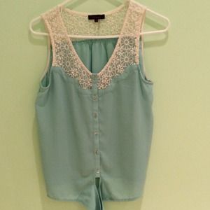 Barely worn, front-tie light blue blouse