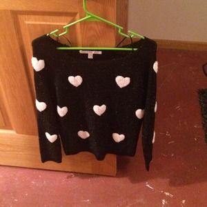 Black sweater with white hearts