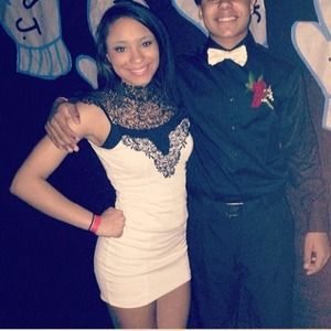 White and black fitted and laced collar dress.