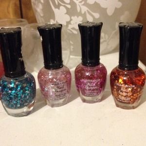 Four bottles of Glitter nail polish