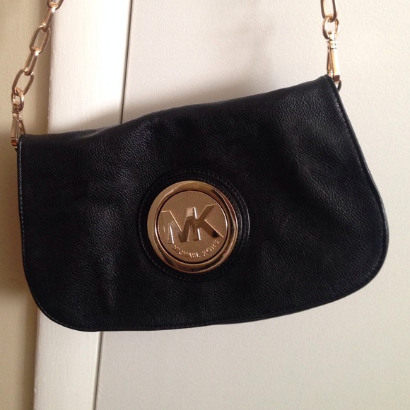 Black and gold little MK bag