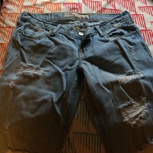 Light colored, distressed bootcut jeans