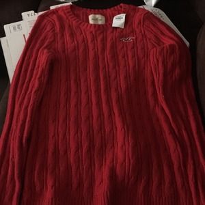 Red hollister sweater. Never worn.