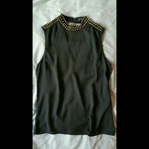 Black sleeveless top with gold studs