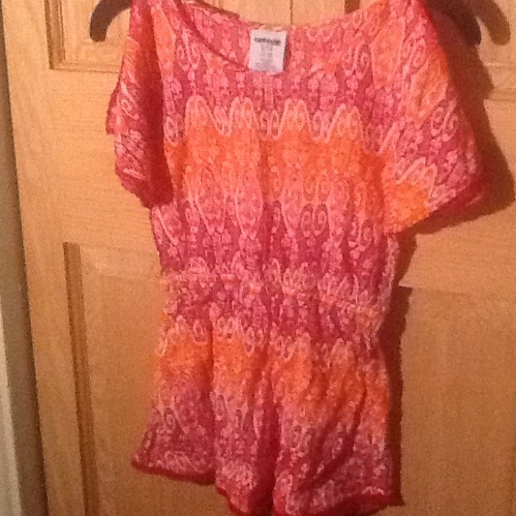 A cute bright red orange and white kids shirt.