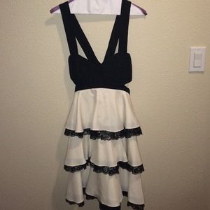 Beautiful black and white open sided dress by BEBE