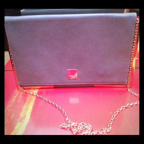 Sky blue clutch, gold rims around it