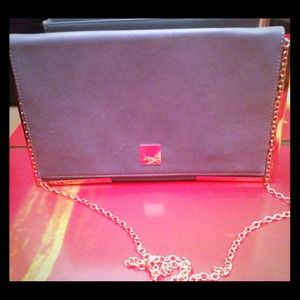 Sky blue clutch, gold rims around it