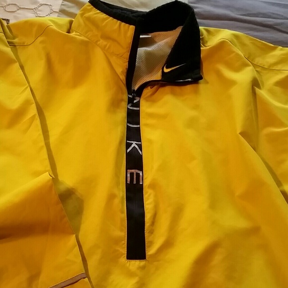 Nike mustard colored nylon pull-over.  RESERVED
