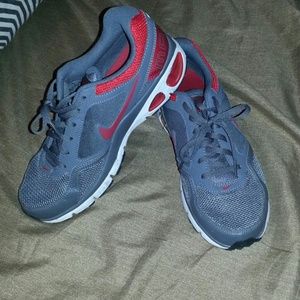 Grey and red Nike running shoes