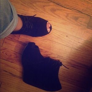 Black peep toe wedge laced bootie.