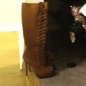 Hold Brand new camel colored knee high boots.