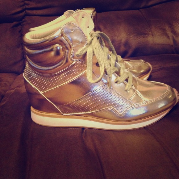 Metallic gold wedge sneakers