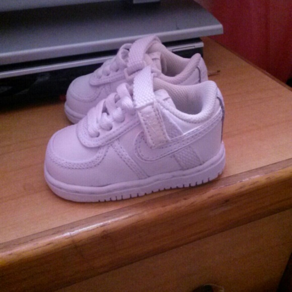 Babys all white nike shoes