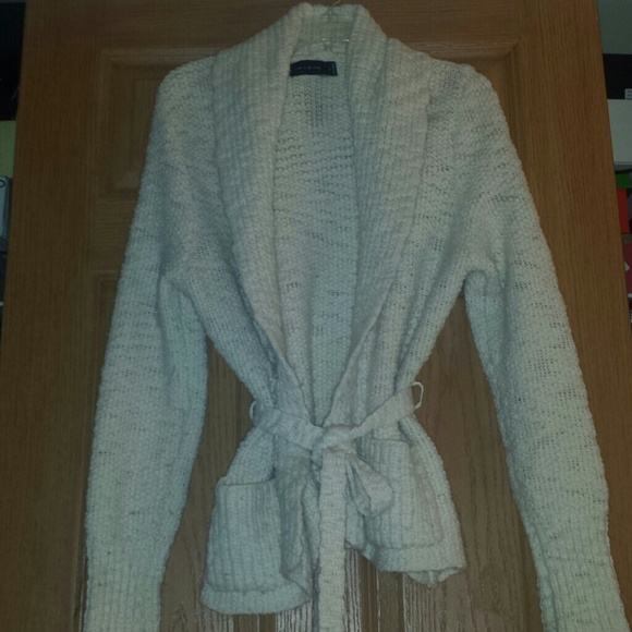 ...Cream belted sweater