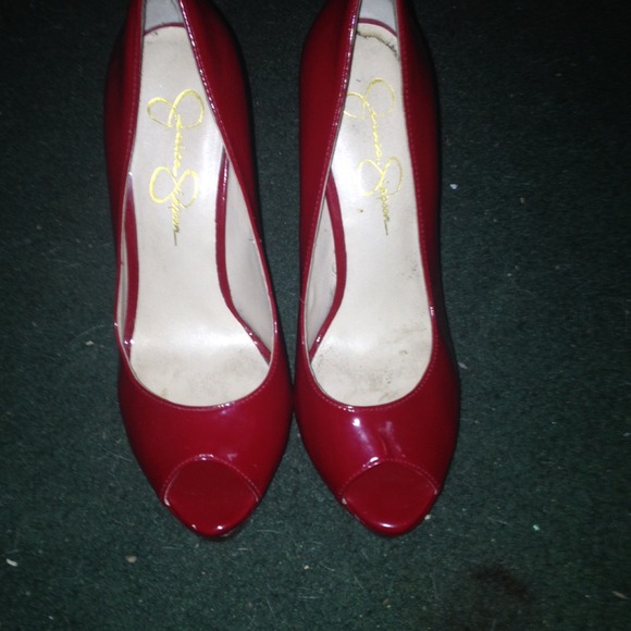 Slightly worn Jessica Simpson red stilettos.