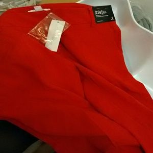 Red slim leg dress pants. Has back pockets.