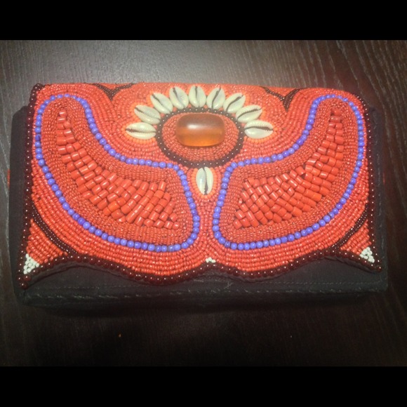 Hand Beaded clutch with long straps .