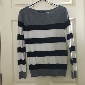 Black, grey, and white sweater.