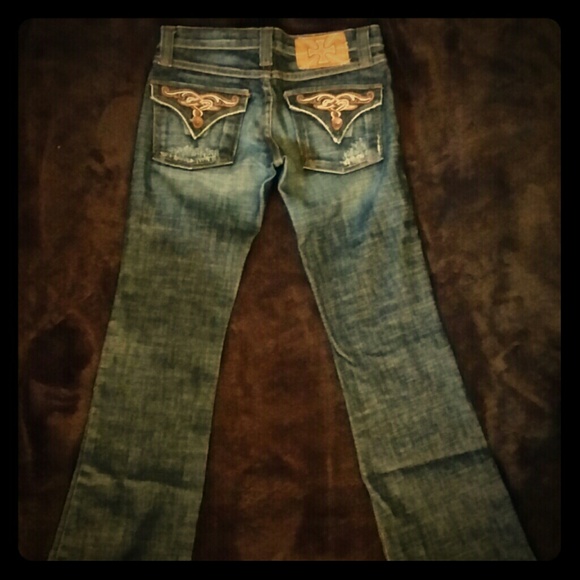 Blue "age looked" jeans, fancy pockets, low rise