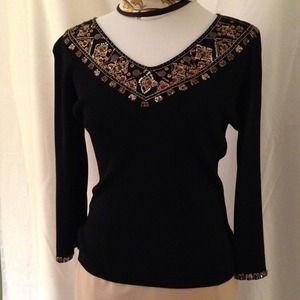 Black knit top with beading.