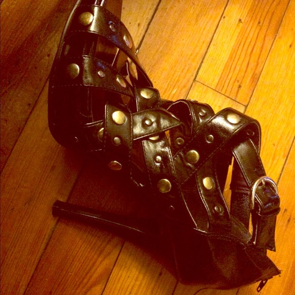 A funky Pair of strap sandles with gold accents