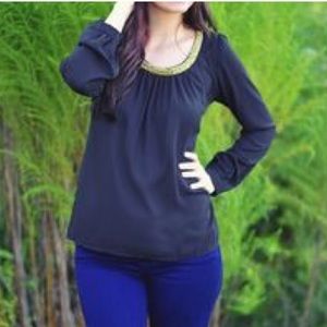 Black blouse with beaded neckline