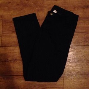Black skinny pants that reach above ankle
