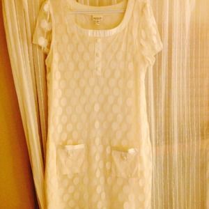 Cute white polka dot dress with pockets.