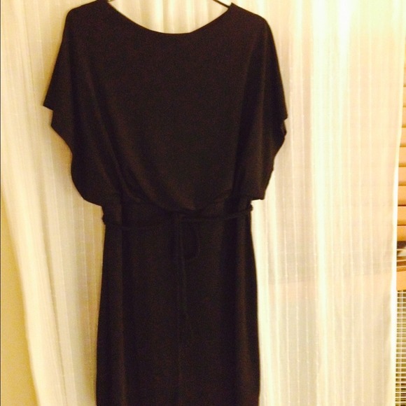 Sexy LBD with open back slit and belt.