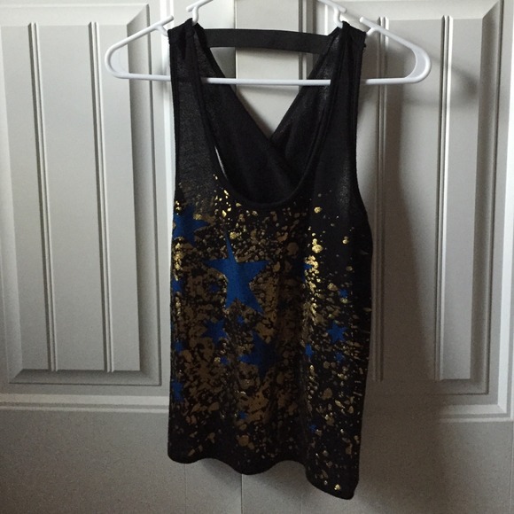 Cross over black, gold, and blue top