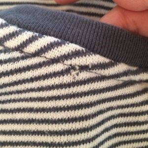 Sweater with small hole on back