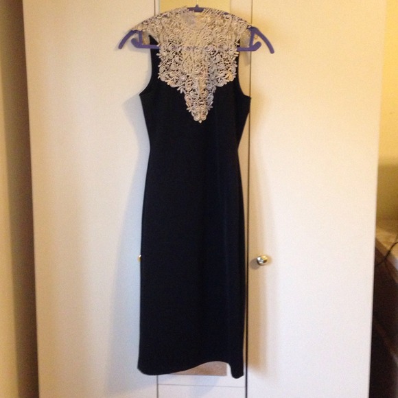 Beige lace trim black dress.