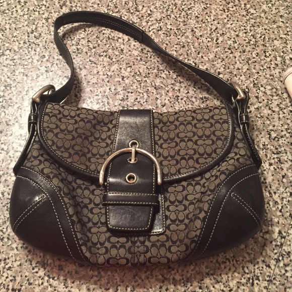 Medium sized black and white coach bag