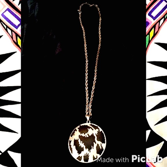 Round, subdued gold and black enamel necklace.
