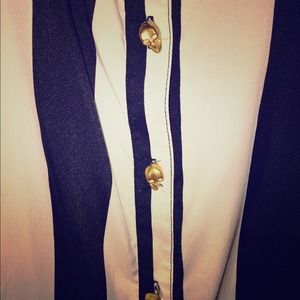 Black and white shirt with gold skull buttons