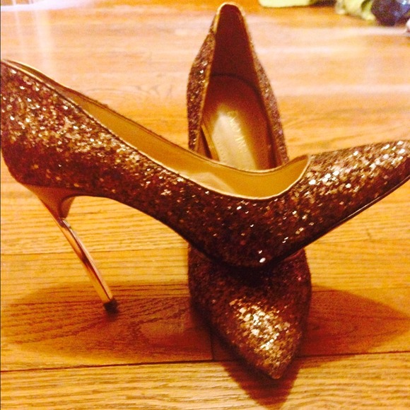 Enzo AngIolini glitter pumps with metallic heel.