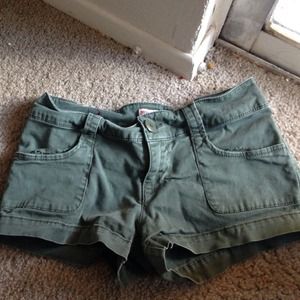 Army green shorts.