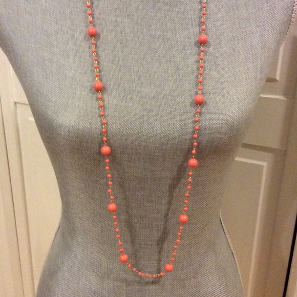 Long peach colored beaded necklace